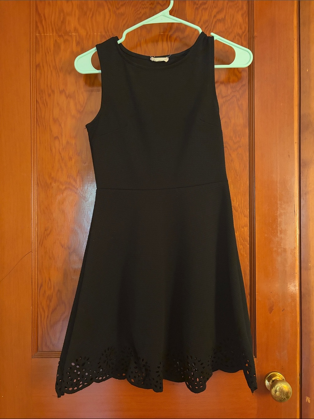 Classic Black Sleeveless A-Line Dress with Laser-Cut Hem